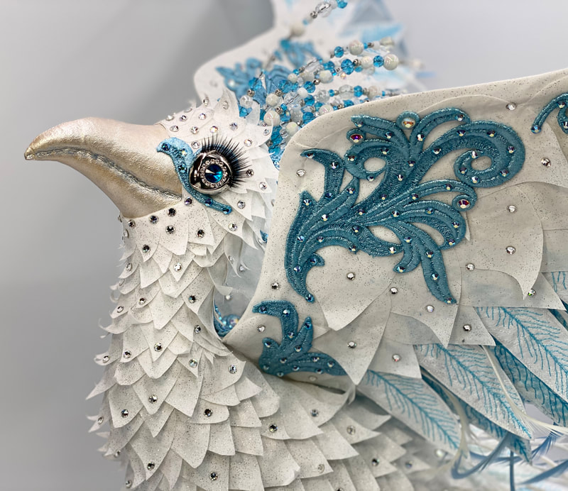 Closeup of Hope, a white phoenix textile sculpture by Linda Blust