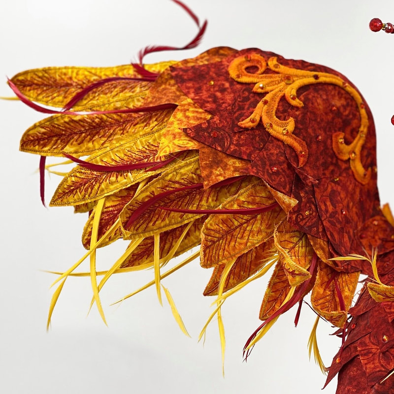 Reemergence, a textile art phoenix sculpture, wing closeup