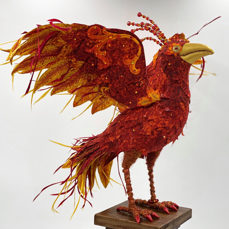 Reemergence, a textile art phoenix sculpture side view