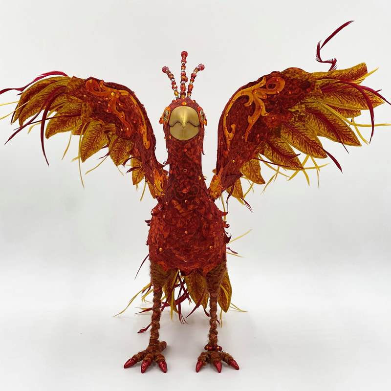 Reemergence, a textile art phoenix sculpture front view