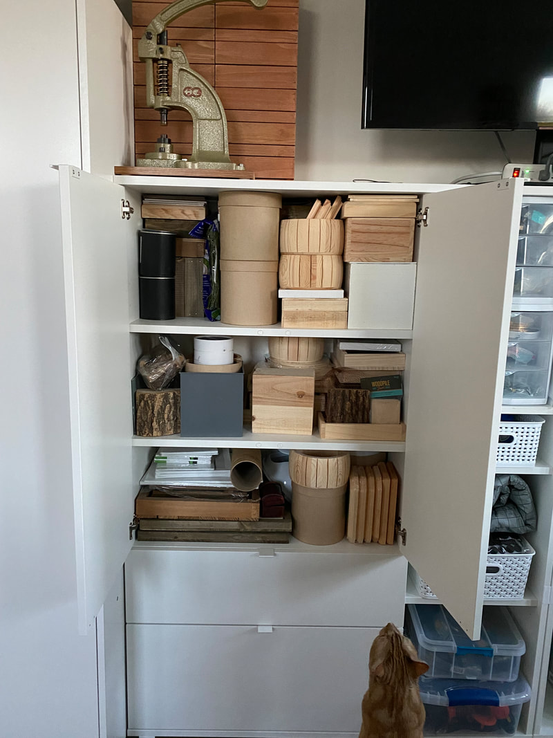 Picture of open cabinet full of art supplies